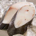 Raw fish fillet on ice with a lemon wedge